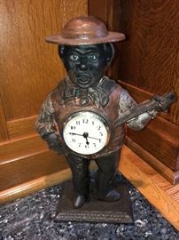 Antique banjo player bronze clock