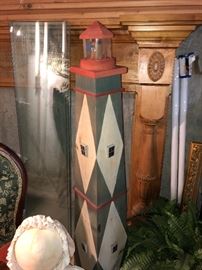 Large wooden lighthouse with shelves