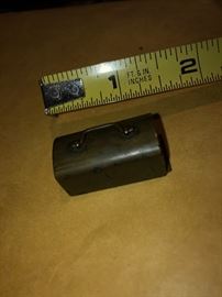 Miniature metal case with dominos inside