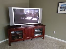 The large TV works all the way!  With a very nice stand below.