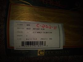 Couristan 8.2 X 11.9 area rug in the front office just off the foyer