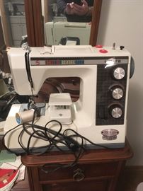 White portable sewing machine, many zig zag and custom stitches.   Works perfect, with case