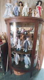 Bow Front Cabinet with More Dolls