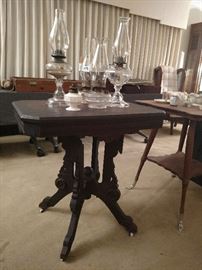 Earlier Victorian  side table, antique oil lamps
