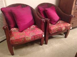 Pair of wicker chairs with pillows