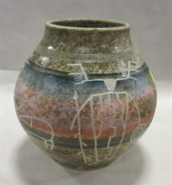 Carved studio pottery vase