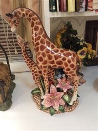 Ceramic mama and baby giraffe.