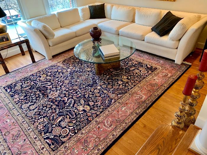 Tabriz rug and sectional white sofa