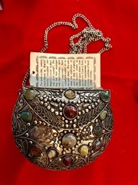 Long chain purse with in bedded stones