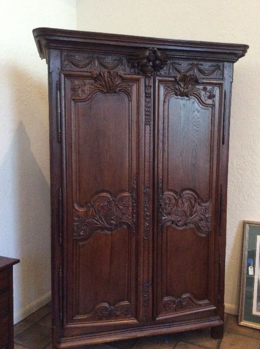 Stunning carved wood armoire