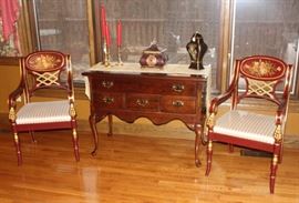 Pair of chairs shown with server/buffet.