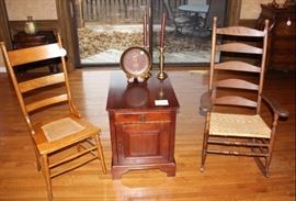 Antique chairs shown with end table.