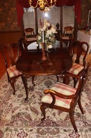 A good view of the chairs and legs of dining room table. The rug is not for sale.