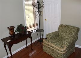 Club chair, hat rack and small library table.