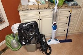 The laundry room is full of cleaning items and supplies.