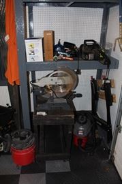 Miter saw with stand, shop vacs and electric chain saw.