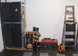 Storage cabinet, tool chest and ladders.