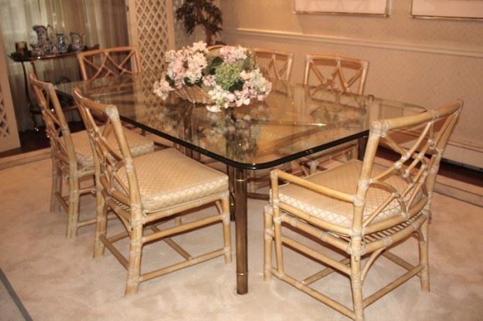 Glass & Chrome Dining Table with 6 Chairs with Cushions and Floral Arrangement