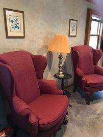 Pair of Wingback chairs (priced individually), and piecrust edge stand with brass lamp