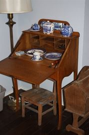 Drop front secretary with Blue Willow and commemorative plates