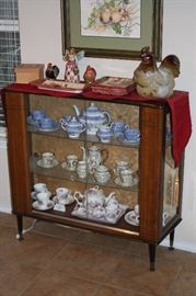 Teasets and a beautiful Midcentury Display case
