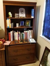 3 shelf two drawer bookshelf and books