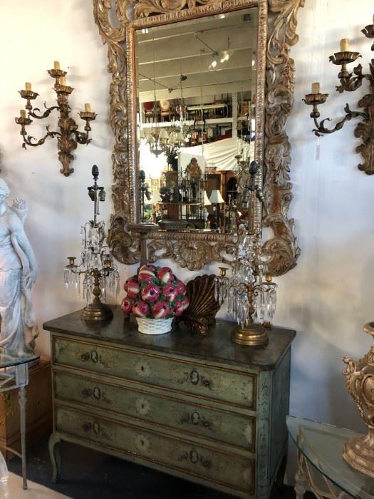 19th century painted commode, shown with silvergilt foliate-carved mirror.