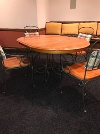 ROUND OAK TABLE WITH METAL BASE AND 4 CHAIRS (COMES WITH LEAF) -62"L x 43"W x 30"H 