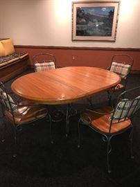 ROUND OAK TABLE WITH METAL BASE AND 4 CHAIRS (COMES WITH LEAF) -62"L x 43"W x 30"H 