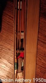 Antique and modern archery equipment.