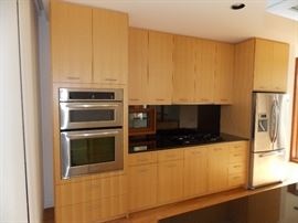 Maple Custom Kitchen Cabinets , Stainless Steel Oven W / Built In Microwave 30" x 42" , GE Profile 5 Burner Cooktop
, 36" Gaggenau Hood , Sorry NO Dishwasher & Refrigerator Opening Size 36" x 70"
 , Black Granite Countertop ,  Island , Stainless Steel Double Sink