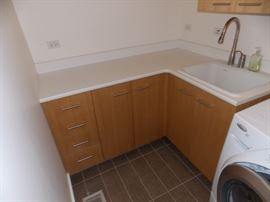 custom Maple Laundry room cabinets with sink 