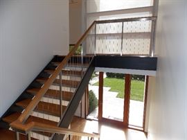 Custom stair case with cable spindles 