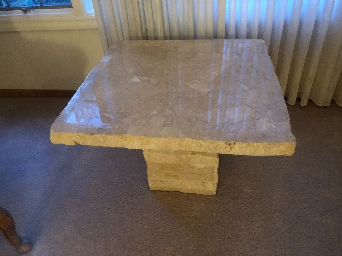 We have three Italian rough-cut travertine tables. 1 console, 1 coffee table, & 1 side table (pictured).