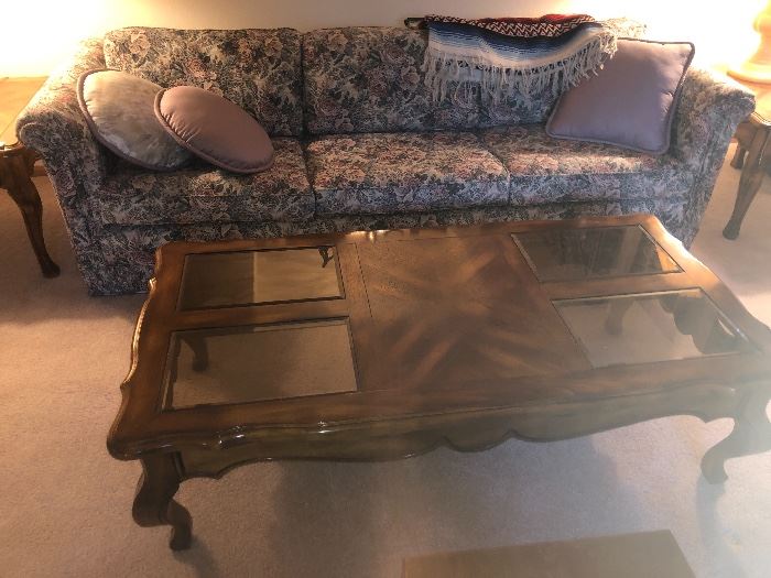 Vintage parquet top, double beveled smoked glass with caribou legs.