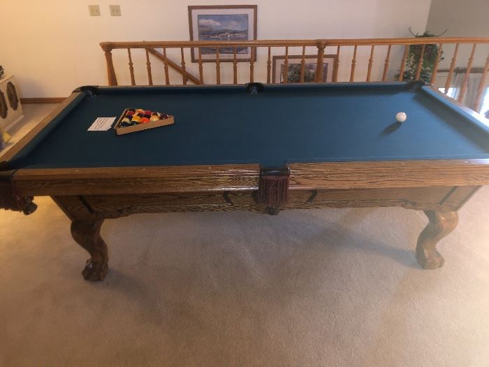 Oldhausen 8' oak pool table. Everything about this table is very nice. Bumpers and felt are immaculate! The hand carved ball & claw legs and scratch free rails could make this table a beautiful addition to your den.