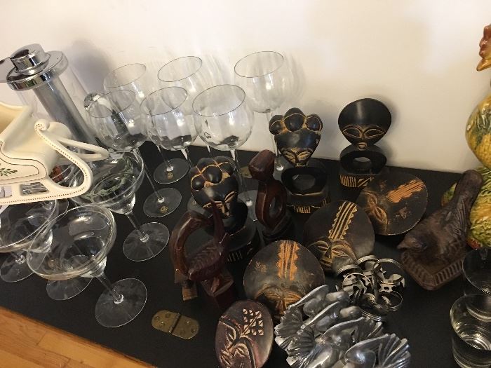 Mix of crystal, masks, small gifts, African napkin rings, glassware, oddities. 