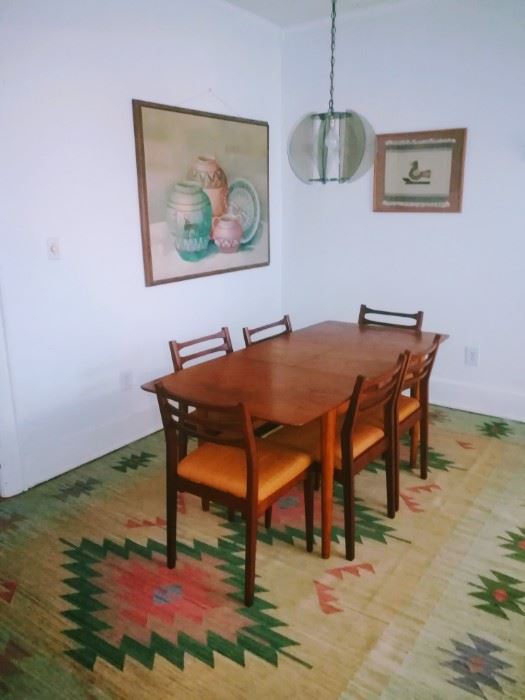 MCM table w/hide-away leaf and 6 chairs, 8' x 11' vintage handwoven Dhurrie rug, large Native American Pottery painting by NIKOL, framed Native American tapestry