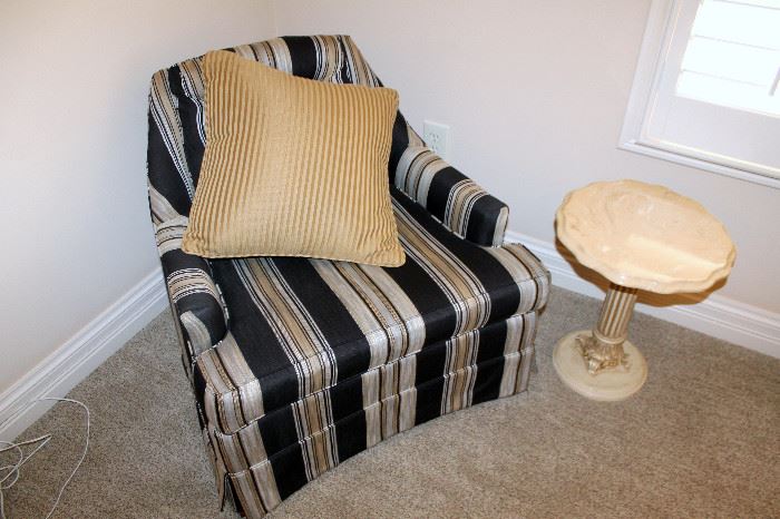 Striped upholstered armchair