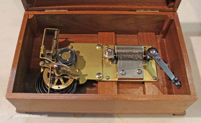  ANTIQUE Walnut Case Automatic Disc Music Box with Swiss Musical Movement and a Walnut Case of 18 Disc by “Thorens”

Located Inside – Auction Estimate $200-$400 