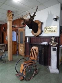 ANTIQUE WHEELCHAIRS, MOUNTED TAXIDERMY, SIGNAGE & BUST ON PEDESTAL 