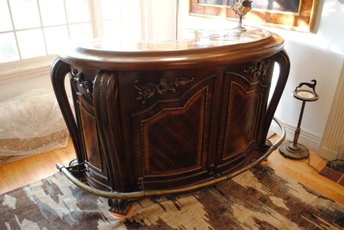 Michael Amini "Oppulente Collection Bar, Marble Top Bar Surface in "Sienna Spice" Curved Shape, Solid Wood, Inlaid Wood Pattern, Carved Rosettes, Antique Brass Curved Foot Rail. 42 1/4 H x 72" W x 30" D. Wider @ Base & Foot Rail.  $1140.00 