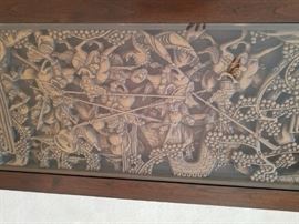 Top of coffee table showing detailed carving