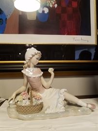 Lladro girl sitting with flower basket