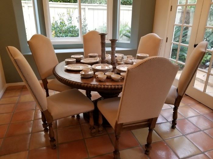 Wood, pedestal dining table with 6 upholstered chairs
