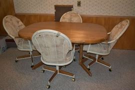 DINING TABLE W/1 LEAF & 4 ROLLING CHAIRS