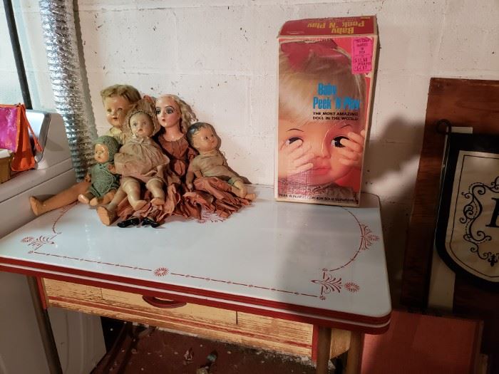 Old dolls, enamel top table