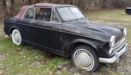 At 8PM: 1959 Hillman Minx Convertible
Black Exterior, Red Interior; Red Convertible Soft Top; Antique Auto; Highly Collectible!; AS IS Condition. VIN: D13293220