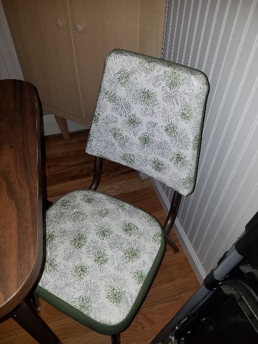 1 of 2 chairs with a vintage table