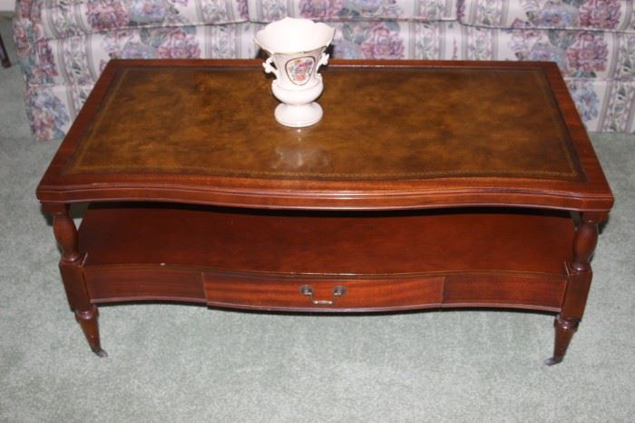 Leather inlaid coffee table with drawer.